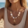 collier beige pendentifs marins